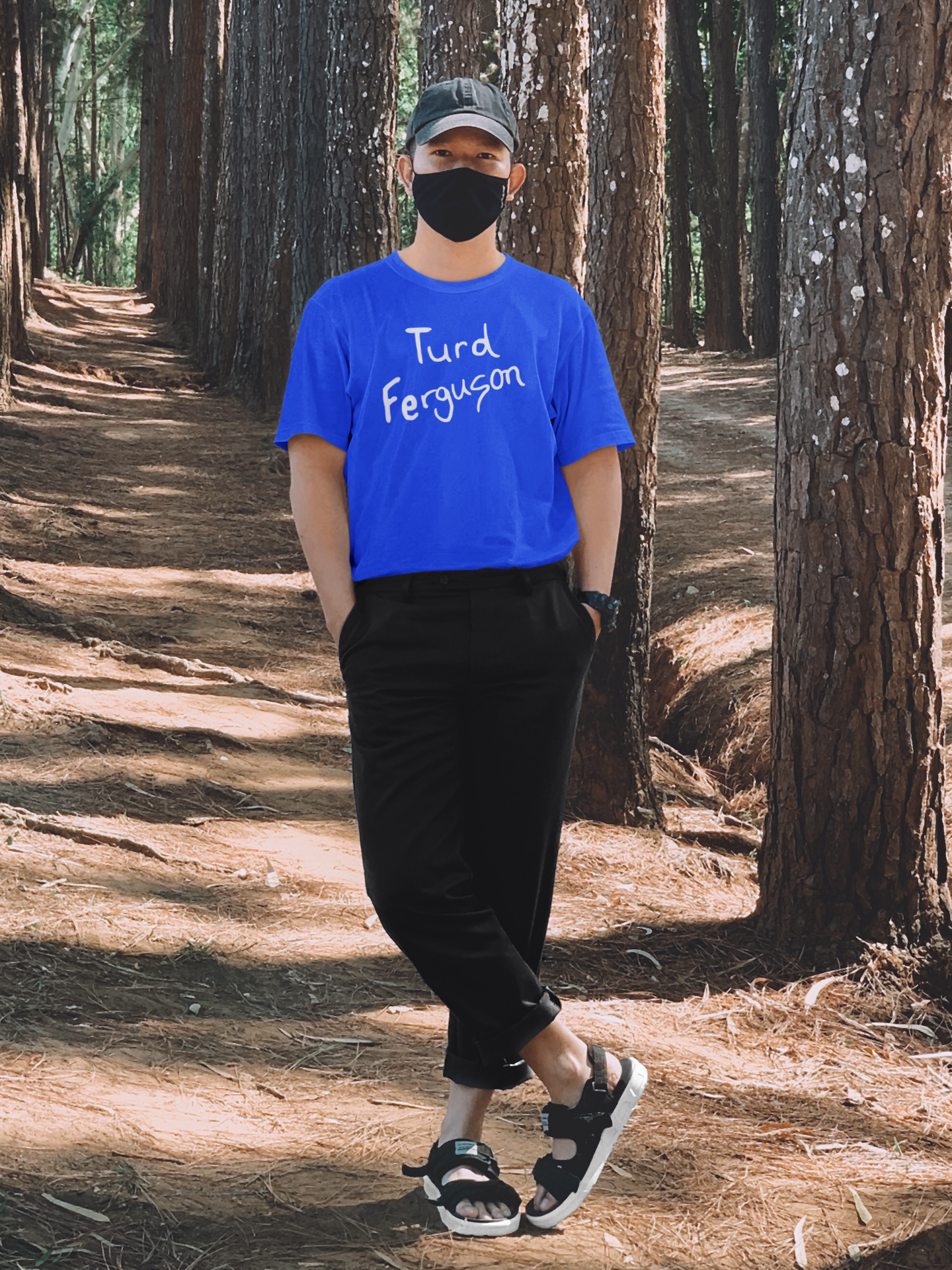 Man wearing Turd Ferguson Tee Shirt